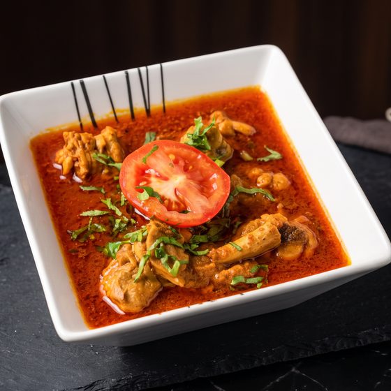 Haddi chicken on dark slate